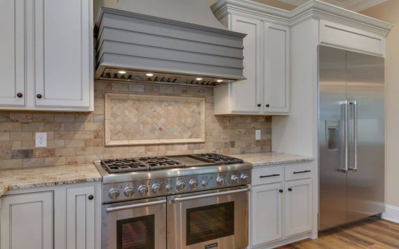 white cabinets with stainless steel appliances
