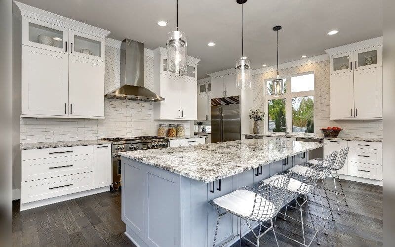 White kitchen with granite countertop kitchen island